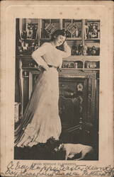 Miriam Clements with her dog, early 1900s Postcard