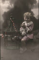 Boy with Bird and Birdcage Postcard