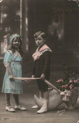 Two Children with Flowers, Joyeux Noel Postcard