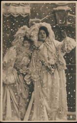 Two Women in White Dresses Posing in Snow Postcard