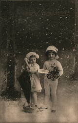 Two Children with Umbrella, Basket, and Holly in Snow, Bonne Année Postcard Postcard Postcard