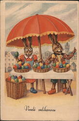 Two Easter Bunnies Selling Colorful Eggs Postcard