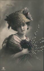 Young Woman with Hat, Flowers, and Pussy Willows Postcard