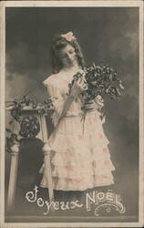 Joyeux Noel - Girl Holding Mistletoe Sprig Postcard