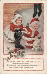 Christmas Santa and Child with Gifts and Stockings Postcard