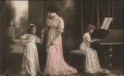 Woman with Two Girls, One Playing Piano Postcard