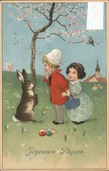 Children, Easter Bunny, and Colorful Eggs Postcard