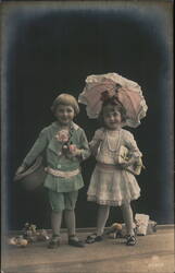 Two Children with Gifts and Parasol Postcard