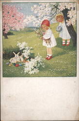 Two Girls and Easter Bunnies with Eggs in Spring Blossoms Postcard