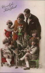 Family Gathers Around Christmas Tree with Gifts and Decorations Postcard