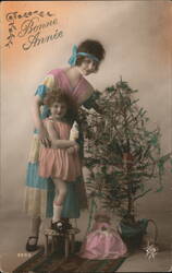 Mother and Daughter with Christmas Tree, Bonne Année Postcard