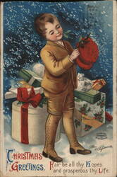 Boy with Christmas Gifts and Holly Postcard