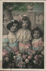 Three Girls with Flowers, Bonne et Heureuse Fete Postcard