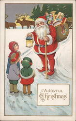 Santa Claus with Lantern Greets Children, Reindeer in Background Postcard