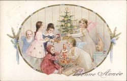 Children and Angels Adorning a Christmas Tree Postcard Postcard Postcard