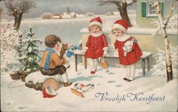 Children Celebrating Christmas with Toys and Tree Postcard