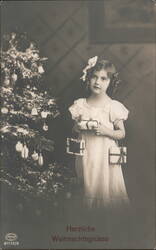 Girl with Gifts by Christmas Tree - Herzliche Weihnachtsgrüsse Children Postcard Postcard Postcard