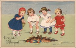 Four Children Discover Easter Nest with Rabbits and Eggs Postcard