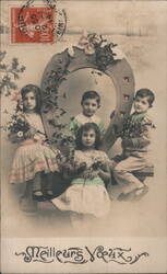 Four Children with Holly Branches in a Horseshoe Frame Postcard Postcard Postcard