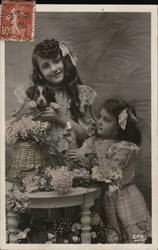 Two Girls with Puppy and Flowers Postcard