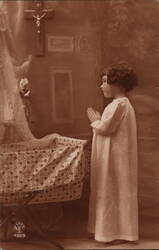 Little Girl Praying by a Cradle Postcard