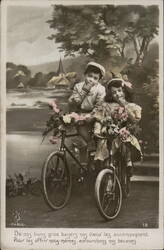 Two Children on a Tandem Bicycle with Flowers Postcard