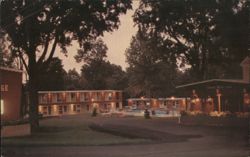 Redwood Motor Lodge at Dusk, Watertown, NY Postcard