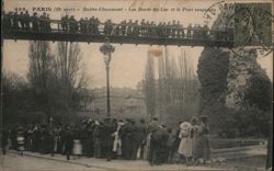 Buttes-Chaumont Park: Lakeside View with Suspended Bridge Paris, France Postcard Postcard Postcard