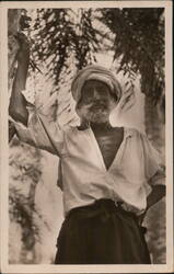 Indigenous Man with Turban in Palm Grove Postcard