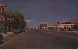 Wells, Nevada Street Scene with Businesses and Cars Postcard Postcard Postcard