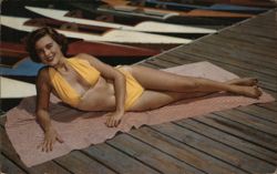 Sunbathing Woman in Yellow Bikini on Dock Postcard