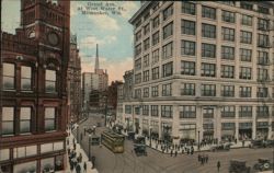 Grand Ave. at West Water St., Milwaukee, Wis. Postcard