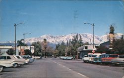 Snow-capped mountain range as seen from Yale Ave., Claremont, CA Postcard