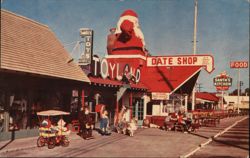 Santa Claus Toyland, Date Shop, and Santa's Kitchen Postcard