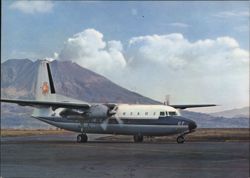 All Nippon Airways NAMC YS-11A-207 JA8707 at an airport with volcano Postcard