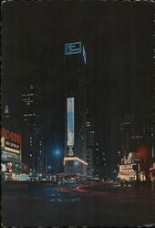 Times Square, NYC - Night View of the Allied Chemical Tower Building Postcard