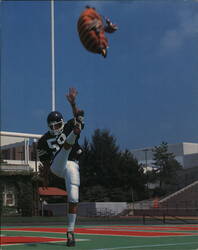 Madison High Football Player Kicking Football Cushion Postcard