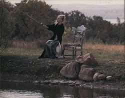 Girl Fishing Beside a Fish Chair Postcard