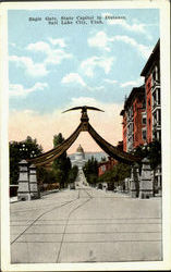 Eagle Gate,State Capital in Distance Salt Lake City, UT Postcard Postcard