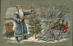 Embossed blue robed Santa cuts a Christmas tree Santa Claus Postcard Postcard Postcard