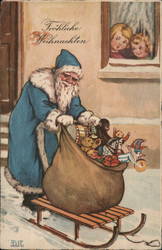 German Children watch Santa in blue robe pushing a sled with a sack of toys on it Postcard