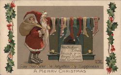 Santa baffled by amount of stockings he is supposed to fill Santa Claus Dudley Buxton Postcard Postcard Postcard