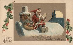 Santa Claus Sitting on Snowy Roof Crossing off List Dudley Buxton Postcard Postcard Postcard