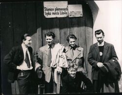 Four Men and a Boy in Front of a Building Postcard