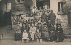 Group Portrait of French Soldiers, Women, and Children Postcard