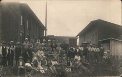 Group Portrait of Children and Adults in Work Clothes Postcard