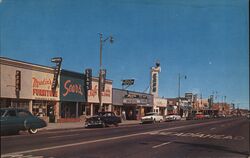 Lancaster, California - Street Scene with Sears and Plaza Theatre Postcard