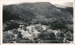 Cherokee Indian Reservation Buildings and Mountain View Postcard