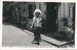 Boy in Native American Headdress Feeding Bear Cub a Coke Postcard