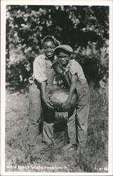 Two Children Holding a Watermelon Black Americana Postcard Postcard Postcard